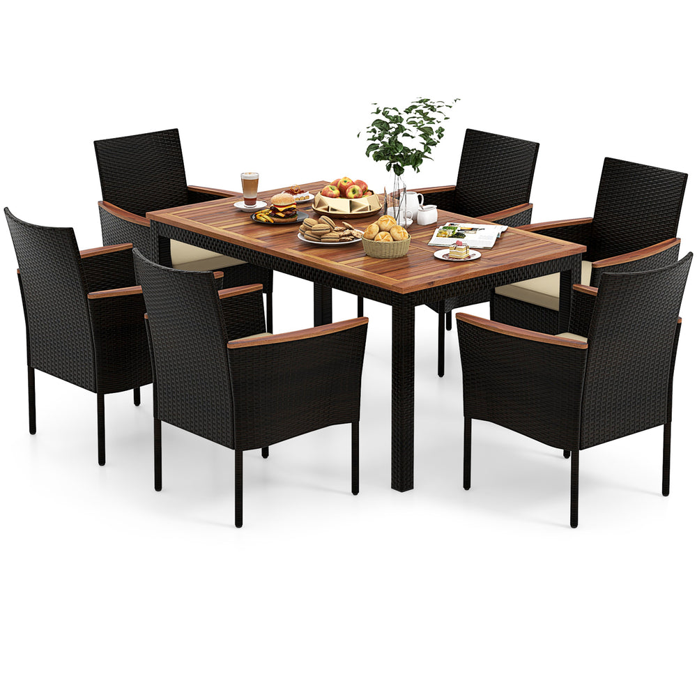 Stylish rattan patio dining set showcasing six stackable chairs around a spacious acacia wood table for outdoor meals.