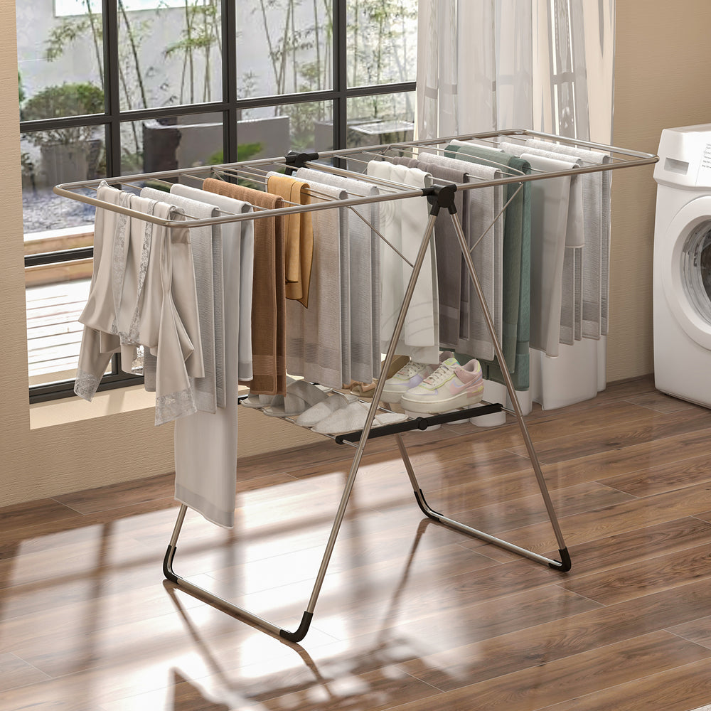 2-tier laundry drying rack with adjustable aluminum wings, compact foldable design, ideal for laundry and bedroom use.