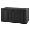 Black 80-gallon outdoor deck box with lockable lid, ideal for storing cushions and tools, featuring a wood-look texture.