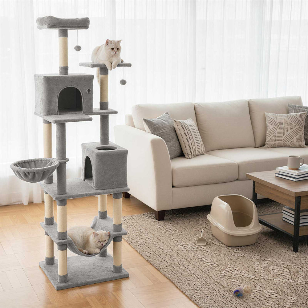 Tall light gray cat tree with two large condos, plush perches, and dangling toys for multiple cats' play and relaxation.