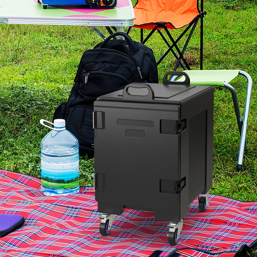 81 Quart insulated food pan carrier with wheels, shown in a picnic setting, ideal for outdoor events and food transport.