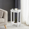 White 2-tier end table with solid wood legs, featuring a storage shelf, perfect for bedside or sofa side use.