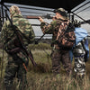 Hunting blind with camouflage pattern, 82" tall, accommodates 3-4 hunters, featuring one-way see-through panels for.