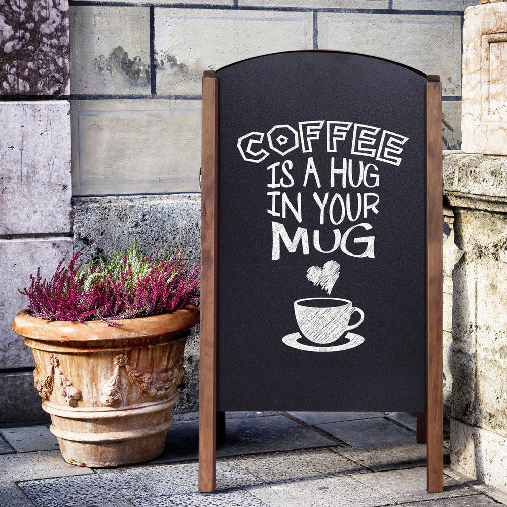 Wood A-frame sidewalk chalkboard sign featuring a coffee message, ideal for advertising and announcements.