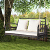 Wicker hanging porch swing with white cushions, durable PE wicker, seats 2, perfect for garden or backyard relaxation.