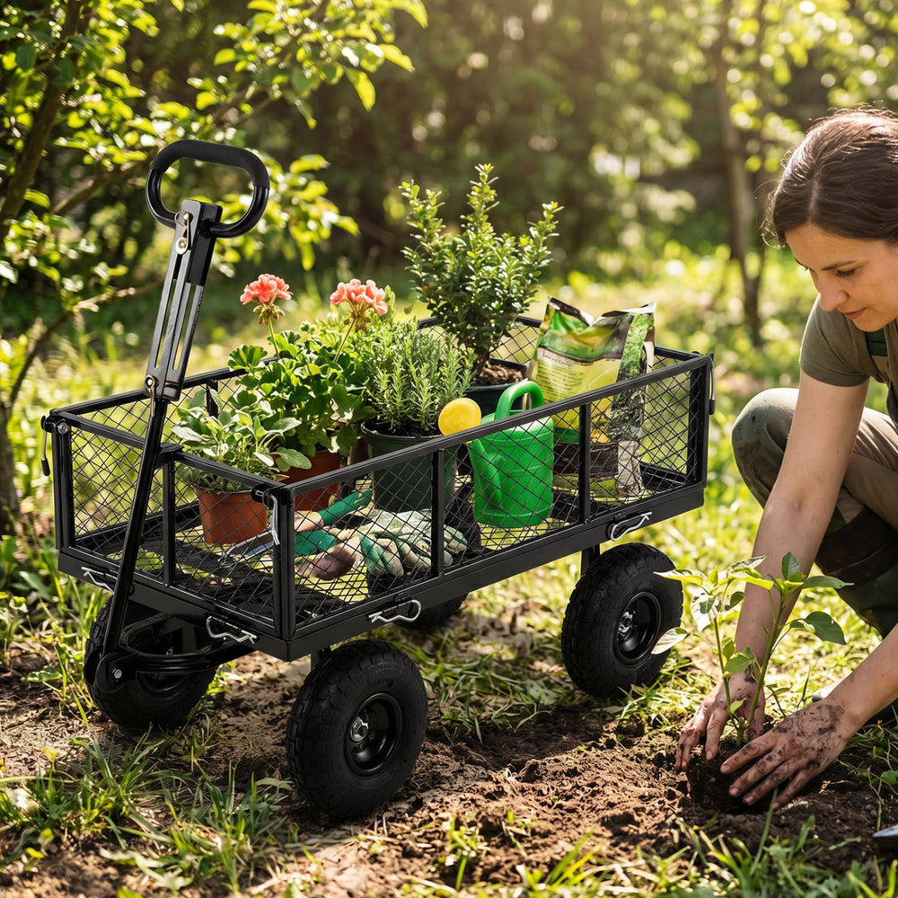 Utility wagon with removable mesh sides, filled with plants and gardening tools, perfect for outdoor gardening tasks.
