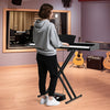 88-key keyboard piano set with adjustable stand, showcasing freestanding use in a music studio setting.