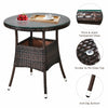Round coffee table with tempered glass top, made of hand-woven rattan, perfect for outdoor patio use.