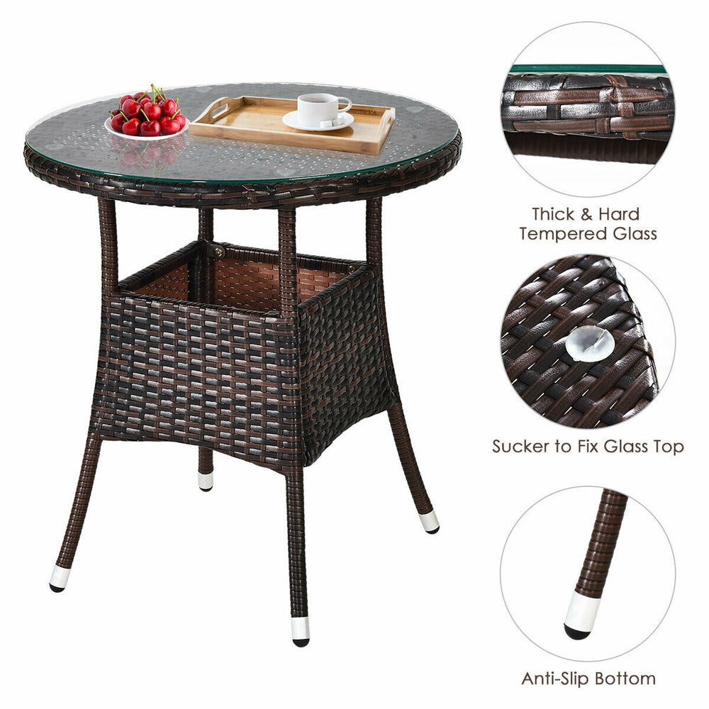 Round coffee table with tempered glass top, made of hand-woven rattan, perfect for outdoor patio use.