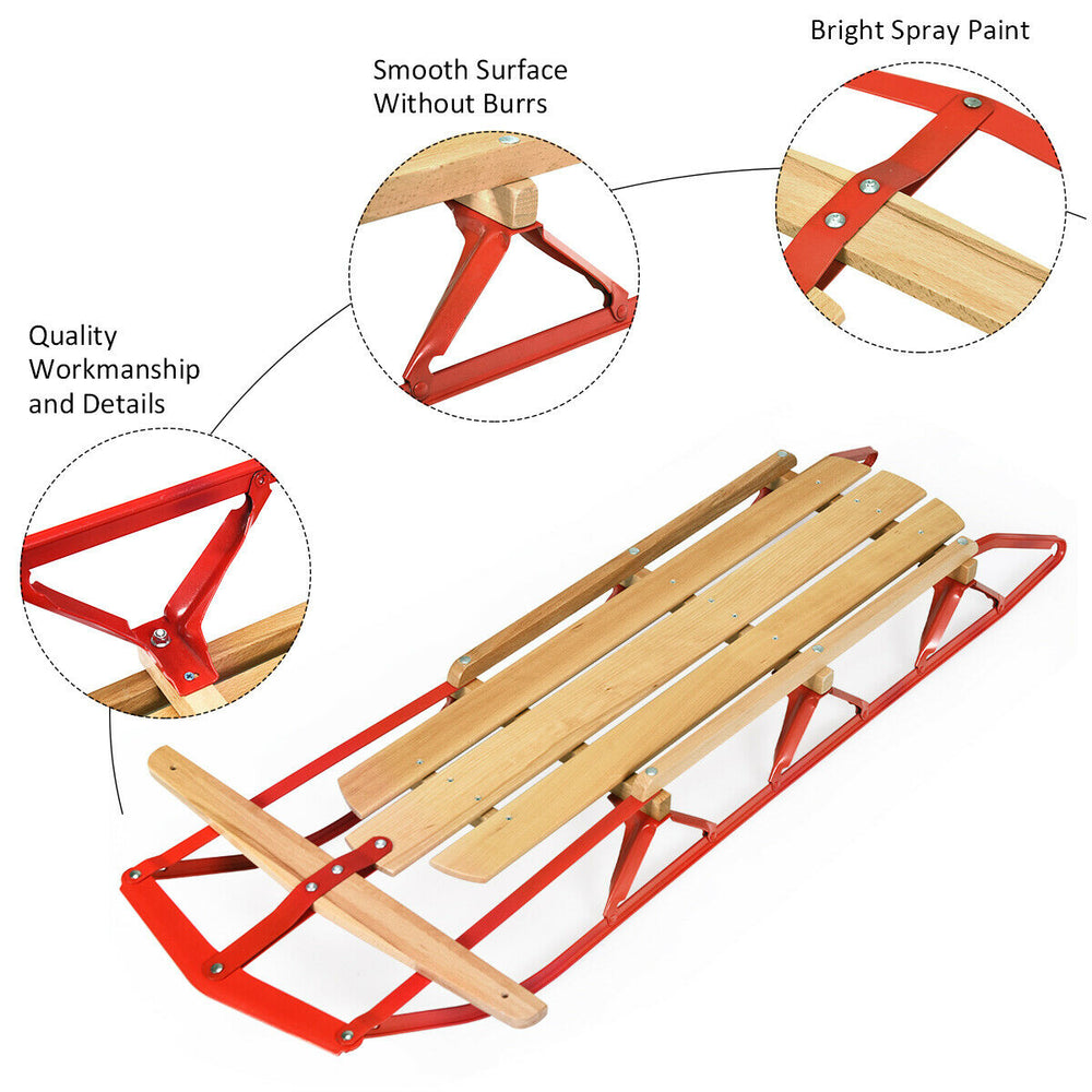 Kids wooden snow sled with metal runners, red paint finish, and steering bar for easy control and smooth sliding.