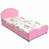 Twin size upholstered toddler bed in pink with playful animal print mattress for safe and comfy sleeping conditions.