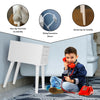 White wooden nightstand with two storage drawers, sturdy legs, and non-slip foot pads for stability in a cozy setting.