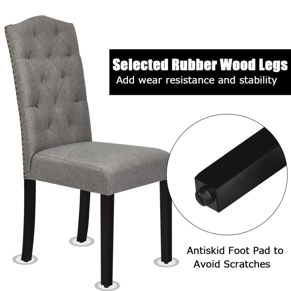 Tufted upholstered dining chair in gray with rubberwood legs, ergonomic backrest, and adjustable foot pads for.