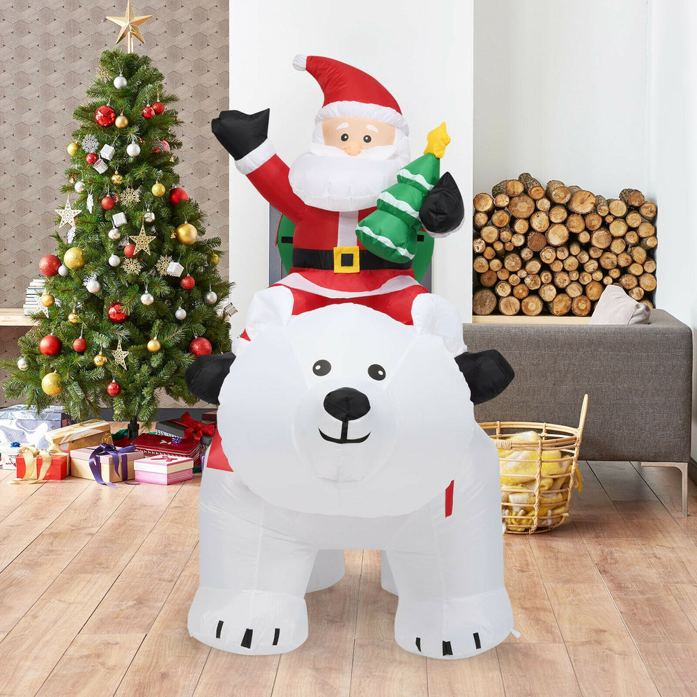 Christmas inflatable Santa riding a polar bear, 6.5 feet tall, with LED lights, perfect for festive yard decoration.