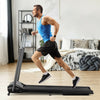Compact folding treadmill in black with a user running, featuring a touch screen and space-saving design for home use.