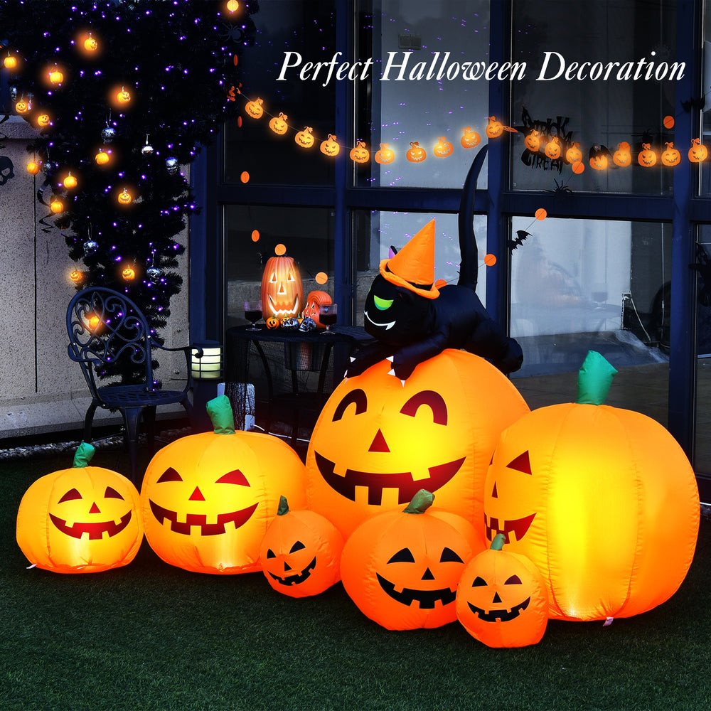 Inflatable pumpkin combo with witch black cat, featuring orange LED lights for Halloween outdoor decoration.