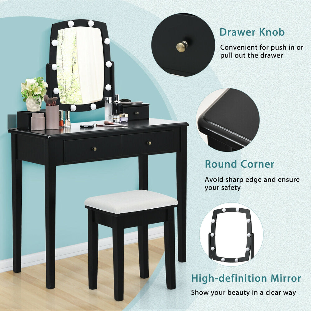 Vanity table set in black with lighted mirror, featuring 10 dimmable bulbs and ample storage for cosmetics.