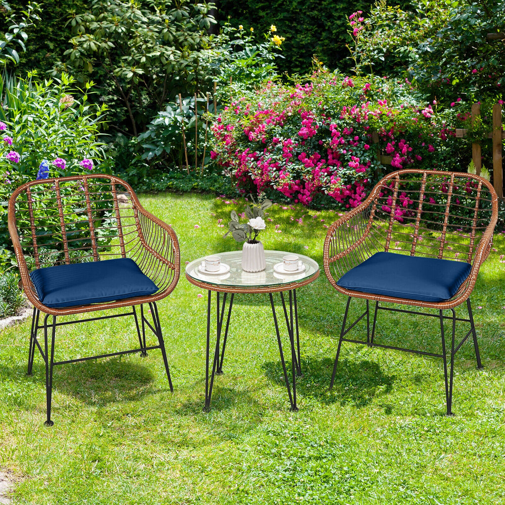 Navy cushioned rattan armchair close-up, showcasing its durable weave and stylish design for comfortable outdoor.