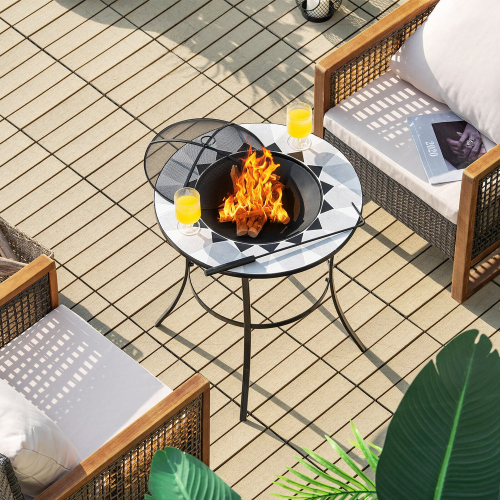 Round fire pit table with mesh cover and poker, featuring a durable steel frame, ideal for outdoor gatherings on the.