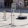Sign holder stand with 360° rotation, adjustable height, and heavy-duty base for displaying signs and notices.