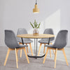 Modern dining chair set featuring four ergonomic chairs with wood legs and fabric cushions, perfect for dining rooms.