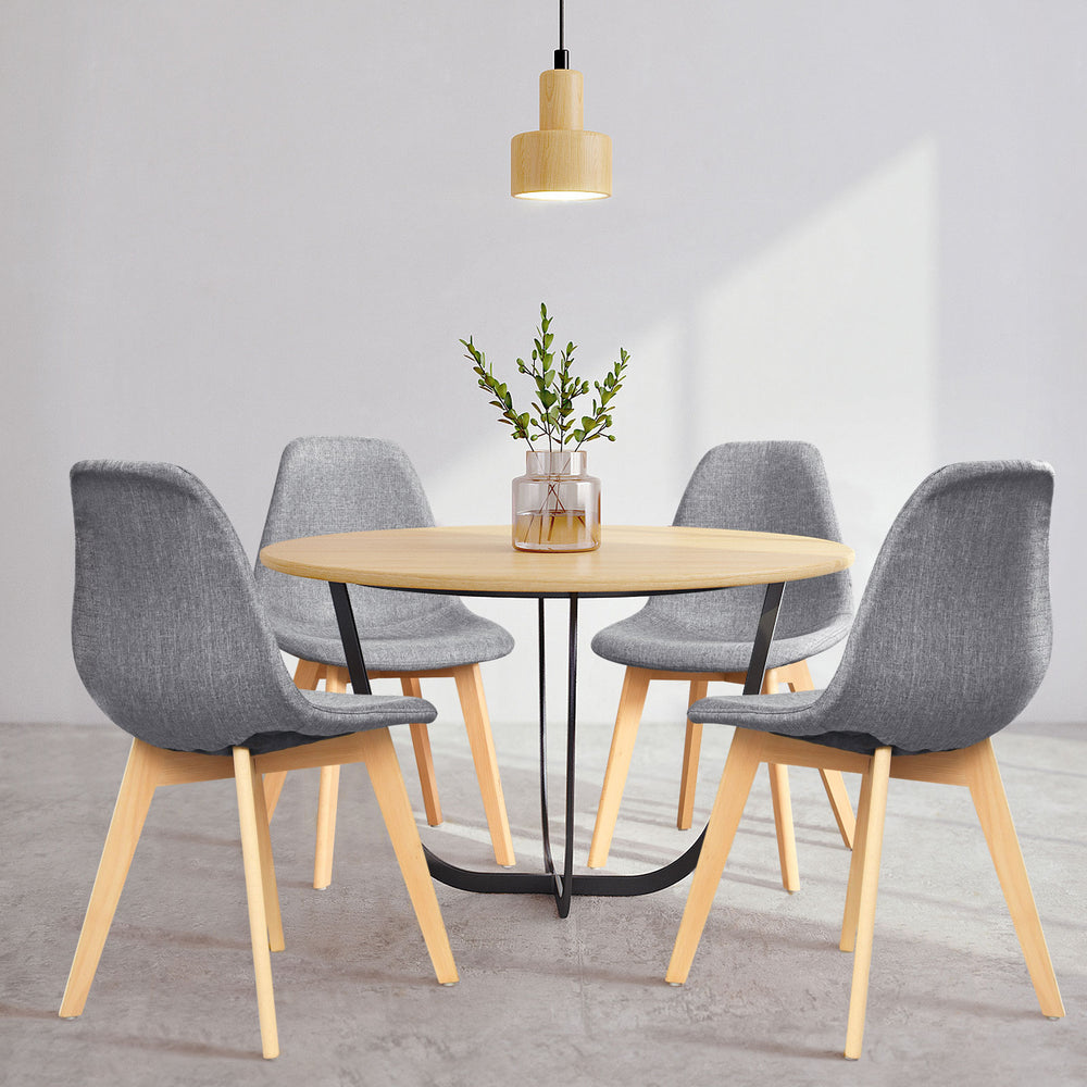 Modern dining chair set featuring four ergonomic chairs with wood legs and fabric cushions, perfect for dining rooms.