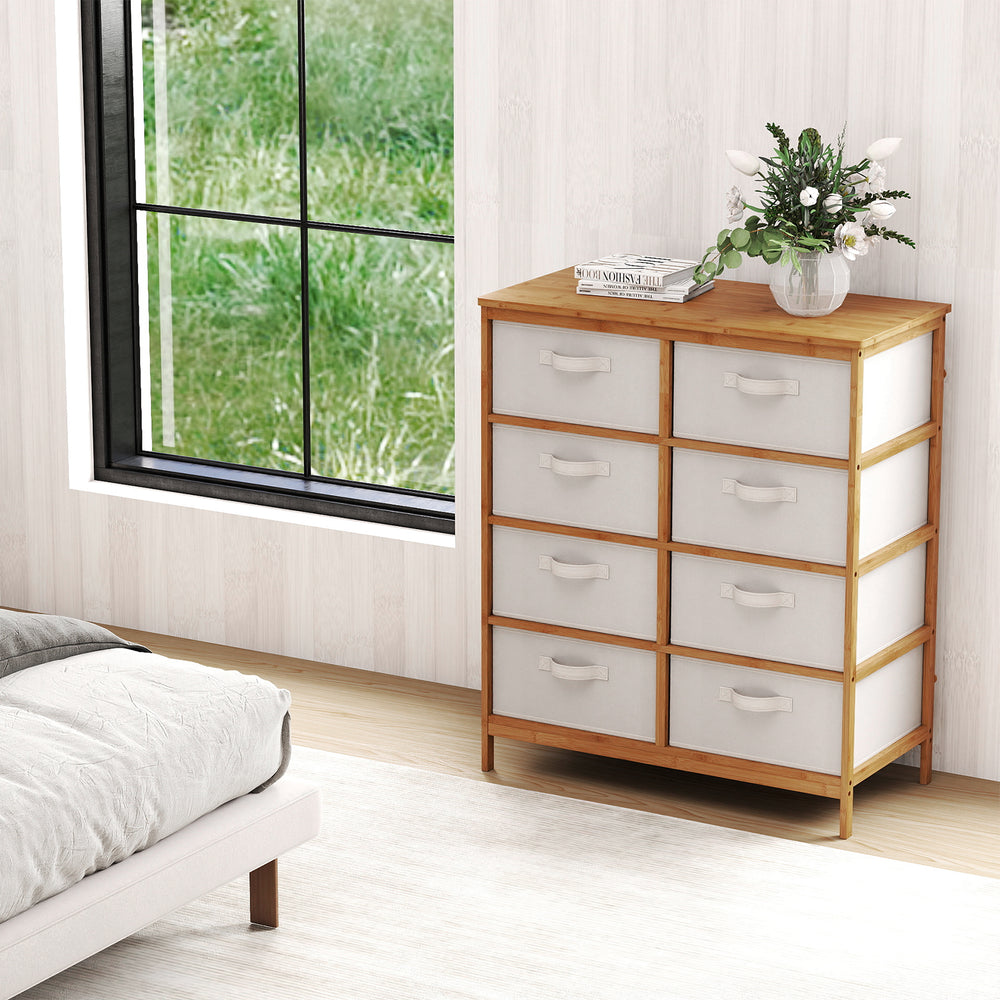 8-drawer dresser featuring a spacious top and removable beige fabric bins, designed for stylish organization in.