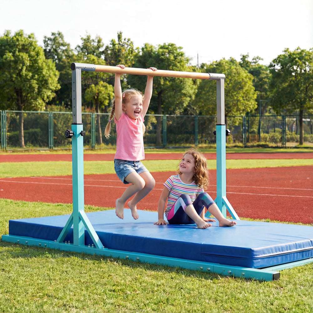 Children enjoying the 8 FT double horizontal bars, featuring adjustable heights, on a padded mat in a grassy field.