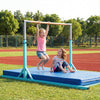 Children enjoying the 8 FT double horizontal bars, featuring adjustable heights, on a padded mat in a grassy field.