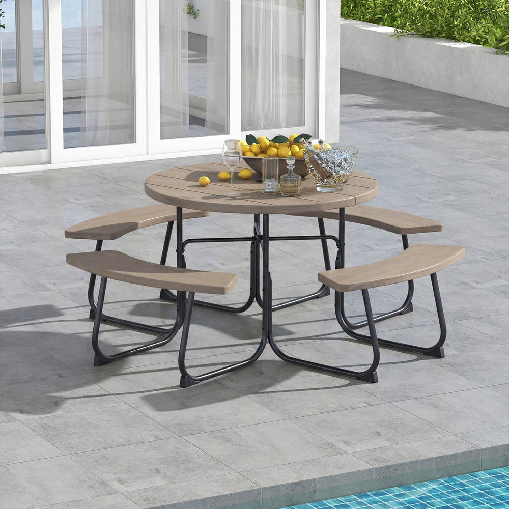 Round rustic brown outdoor picnic table and bench set for 8, featuring a sturdy metal frame and built-in umbrella hole.