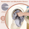 Removable gray suede cover being placed in a washing machine for easy cleaning of the 8-piece kids play couch.