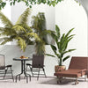 Chaise lounger and bistro set from the 8-piece outdoor furniture set, perfect for patios and balconies.