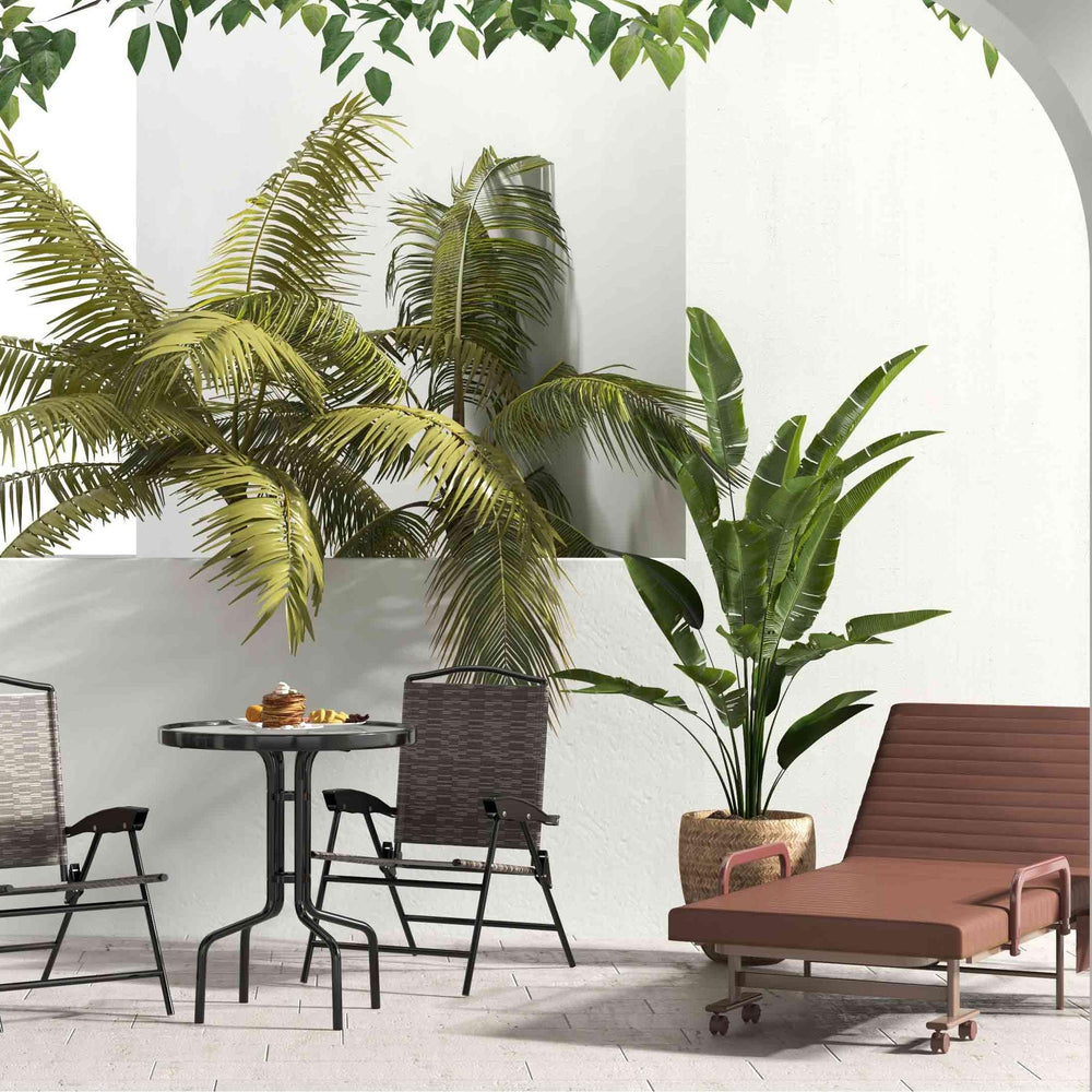 Chaise lounger and bistro set from the 8-piece outdoor furniture set, perfect for patios and balconies.