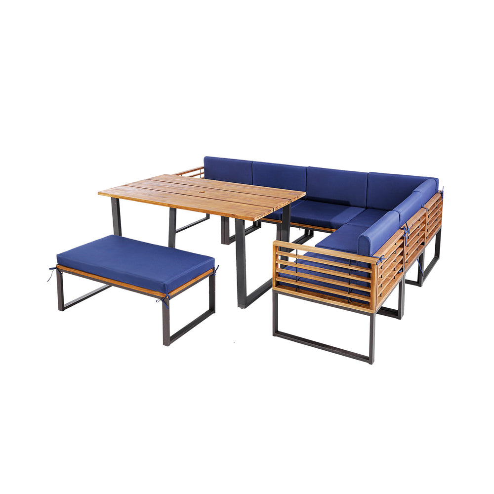 Patio dining set featuring acacia wood table and navy cushions, ideal for outdoor relaxation in backyard or poolside.