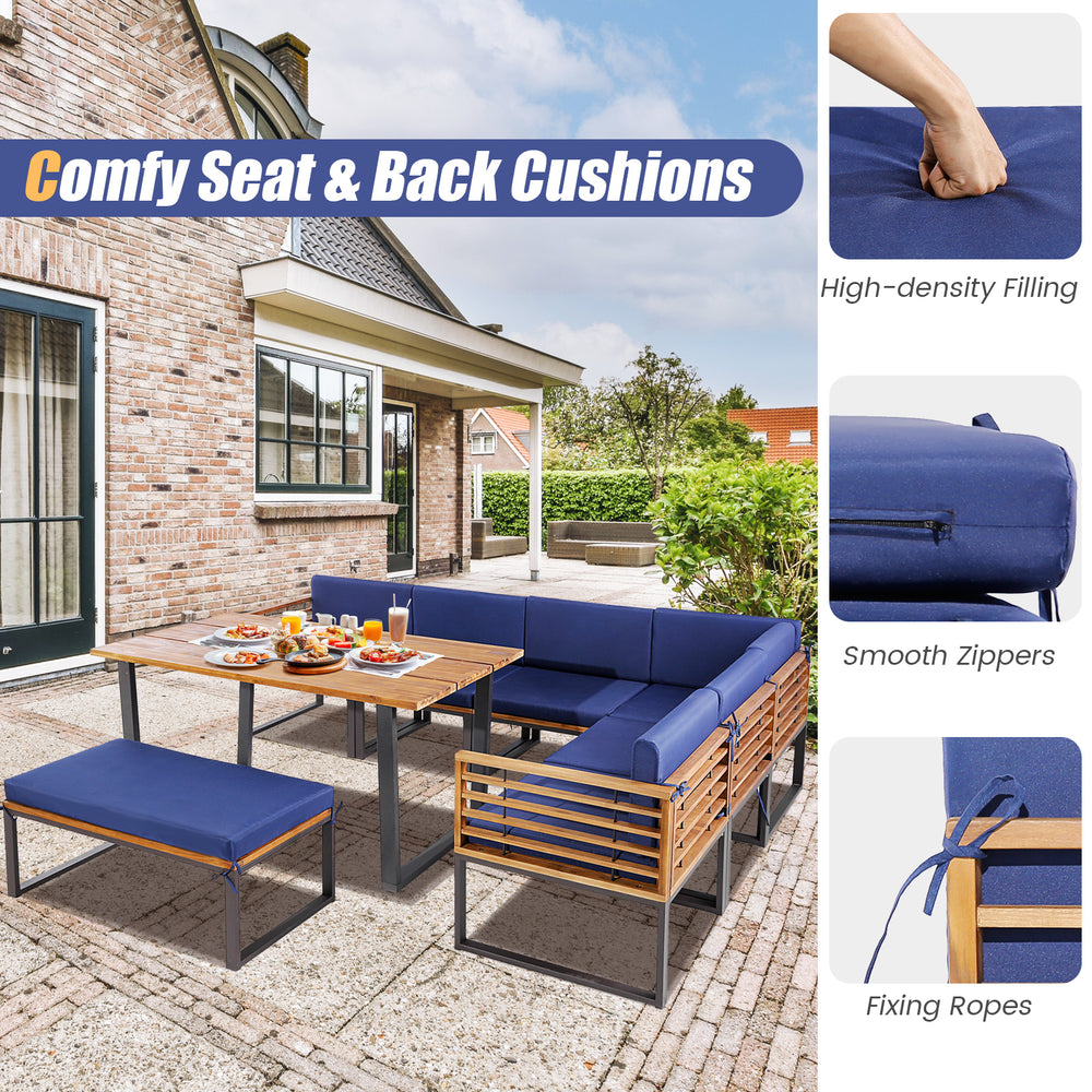 8-piece patio dining set featuring navy cushions, acacia wood table, and ottoman for outdoor relaxation.