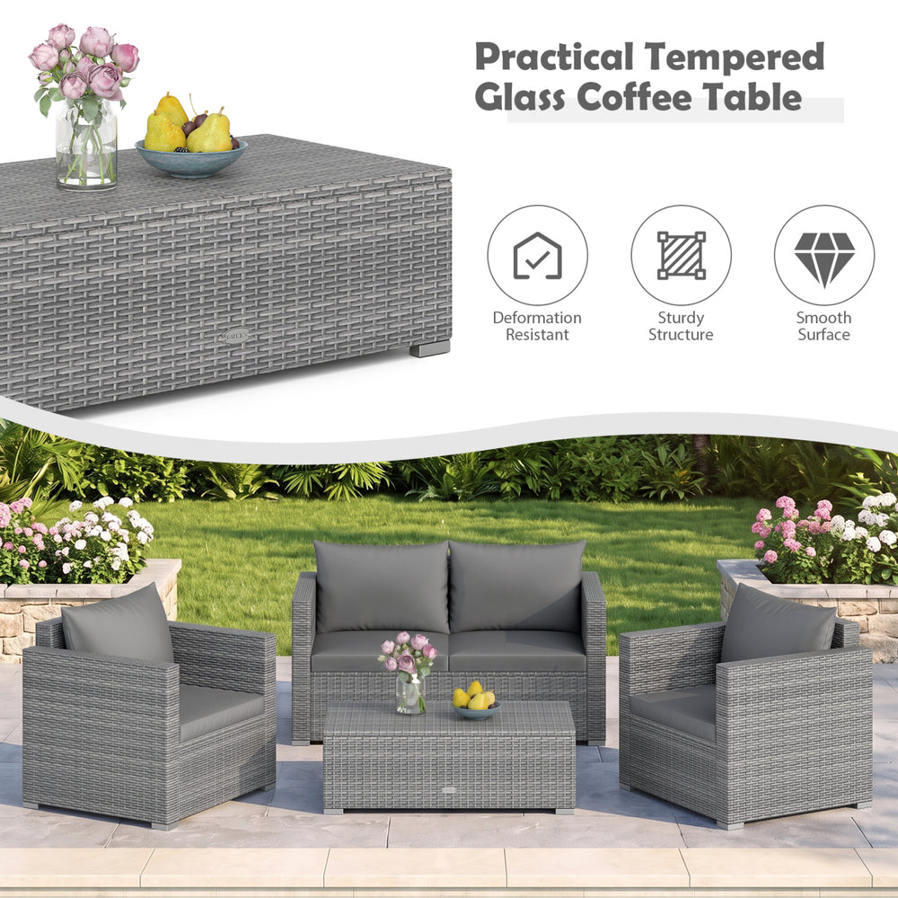 Gray patio rattan coffee table with tempered glass surface, designed for outdoor use and easy cleaning.