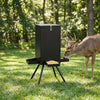 Gravity deer feeder with a 90LB capacity, four feeding trays, and a stable black 4-leg stand for outdoor use.