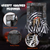 Animated 18-inch hanging skull prisoner with realistic chains, LED eyes, and creepy sound effects for Halloween decor.