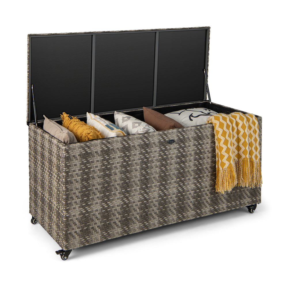 Gray 96-gallon PE wicker outdoor storage box with 4 wheels, ideal for storing cushions and blankets.
