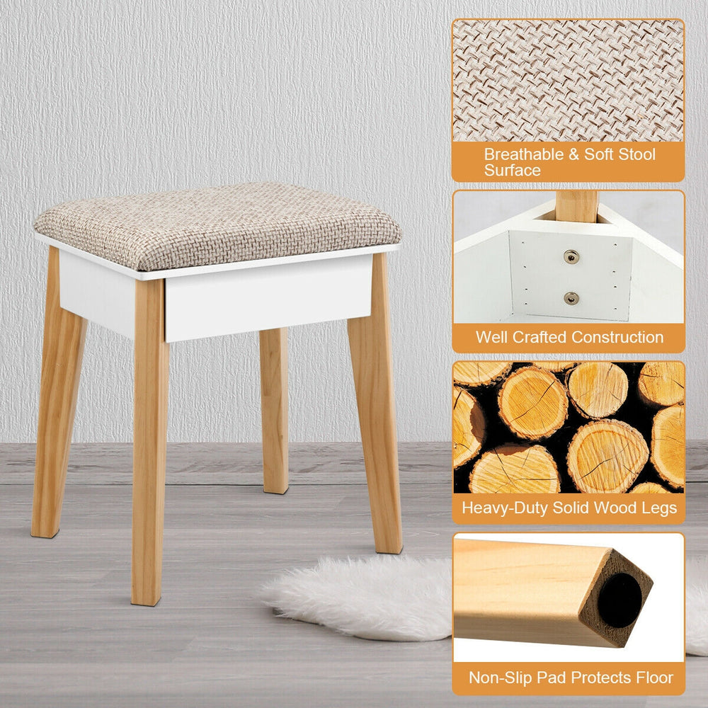 Cushioned stool with soft surface and solid wood legs, designed for comfort and stability in a vanity table set.