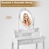 Rounded and rotatable mirror with dimmable bulbs on a white makeup vanity dressing table set for versatile use.