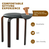 Round stool with padded seat and bentwood legs, stackable design in black for space-saving dining solutions.