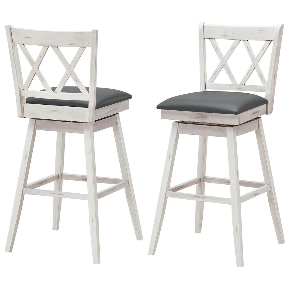Set of 2 swivel counter height barstools with rubber wood legs and PVC leather cushions for versatile seating.
