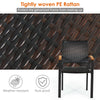 Close-up of tightly woven PE rattan on a patio dining chair with acacia wood armrests, ideal for outdoor use.