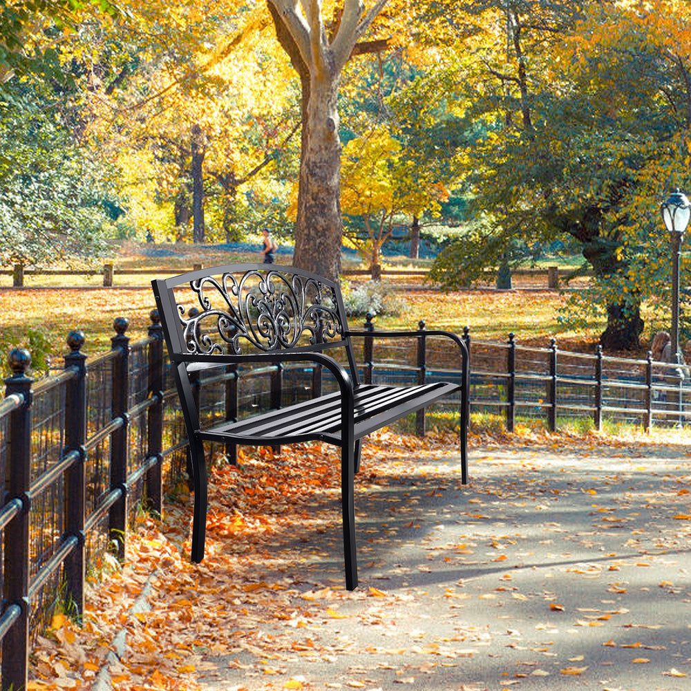 Steel frame patio bench with cast iron backrest, perfect for outdoor parks and gardens, showcasing elegant design.