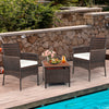 Two outdoor PE rattan armchairs with removable cushions, perfect for poolside relaxation and durable against weather.