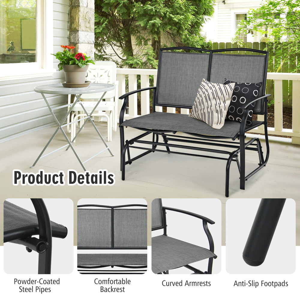 Gray iron patio rocking chair with comfortable backrest and curved armrests, perfect for outdoor relaxation.