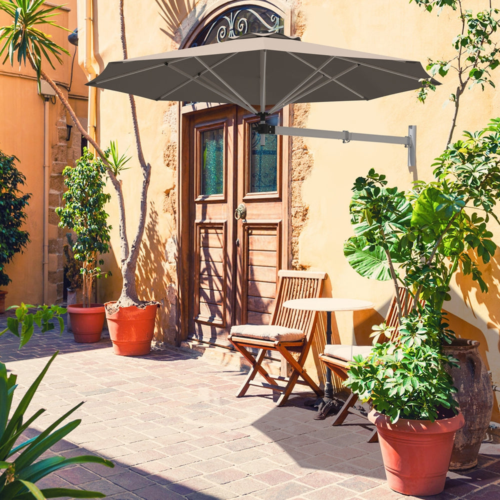 Wall-mounted 8ft tan sun shade umbrella with adjustable angle, aluminum frame, ideal for outdoor patios and gardens.