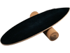 Balance board trainer in black with cork roller, designed for core strength and stability exercises at home or gym.