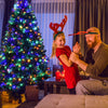 Pre-lit artificial spruce Christmas tree with 550 multicolor lights, designed for easy assembly and perfect for holiday.